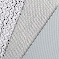 three different types of fabric on top of each other, one white and the other grey