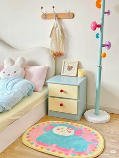 a child's room with a bed, dresser and toys