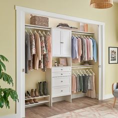 an open closet with clothes and shoes hanging on the wall, next to a chair