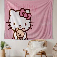 a hello kitty wall hanging in a living room