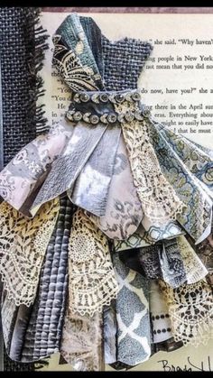 an altered photograph of fabric and lace on a book page with words written below it