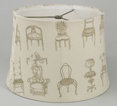 a lampshade with chairs on it and a lamp shade in the shape of a chair