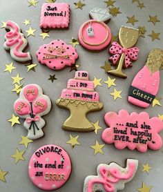 some pink and gold decorated cookies are on a table with stars around them, including one that says i do not know what the other is