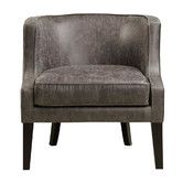 the arm chair is upholstered and has a dark wood frame, with a light gray leather finish