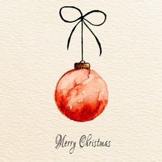 a watercolor christmas ornament hanging from a ribbon