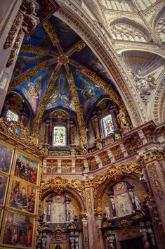 an ornate church with paintings on the walls