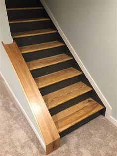 there is a wooden stair case on the floor