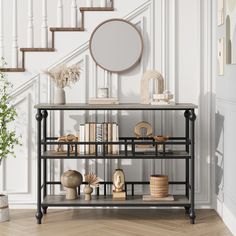 there is a shelf with books and vases on it in front of the stairs