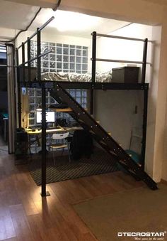 a loft bed with stairs in an apartment