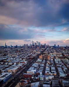 an aerial view of a large city with lots of tall buildings in the foreground