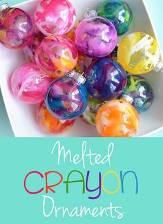 a bunch of balls that are on top of a white plate with the caption melted crayon ornaments