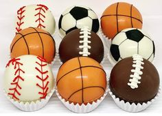 chocolates decorated with sports balls are arranged in rows