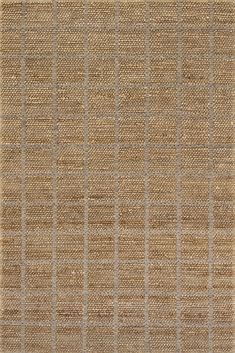 an area rug with lines on it in brown and beige colors, made from jute material