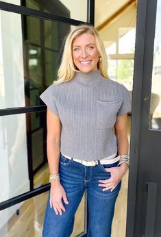 Elevate your wardrobe with our Simple Solution Sweater in Charcoal! This ribbed short sleeve mock neck sweater features a front pocket detail, adding both style and functionality. Stay cozy and on-trend in this versatile piece. By Entro Model is 5'4 wearing a small Fits true to size 49% viscose, 28% polyester. 23% nylon