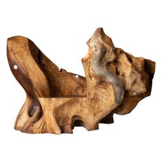 a piece of wood that has been carved into the shape of a dog's head