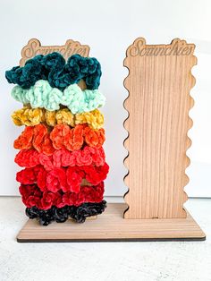 Display your scrunchies on a wooden display stand. Scrunchie Stand Diy, Scrunchie Holder Display, Scrunchie Craft Fair Display, Display Crochet Items Craft Fairs, Scrunchie Display Ideas, Scrunchies Display Ideas, Headband Display Craft Show, Scrunchie Display Craft Show, Diy Display Stand Craft Fairs