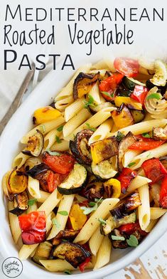 a white bowl filled with pasta and vegetables