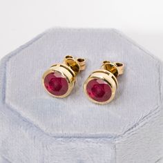 "Round Cut Ruby Studs,Dainty Ruby Earrings,14k Solid Gold Studs,Natural Gemstone,Minimalist Earrings,Bridal Gift,Red Earrings,July Birthstone ★ ★ CUSTOM/DUTY-FREE SHIPPING WORLDWIDE, BUYERS DON'T HAVE TO PAY ANY CUSTOM FEES WHILE IMPORTING ★ ★ Details Made to order Material: 14k/18k Gold Color Options: Yellow Gold, White Gold, Rose Gold, ★ Center Stone: Natural Ruby,Round Size: 8mm ★ 100% Natural Diamond and Gemstones ☂ Shipped with Insured Shipping within 4-7 business days. ➦ 100% Free Returns. ✈ We offer free EXPRESS shipping across the world. ➽ Be sure to hit \"favorite\" on the right so it remains on your favorites list and/ or add to your wishlist(s). ☎ If you have any additional questions, just hit the \"Ask a Question\" button (just to the right of the price) and we will get back to Ruby Earrings Studs Gold, 14k Gold Gemstone Round Earrings, Red Ruby Earrings, Ruby Earrings Studs, Bridal Gift, Favorites List, Ruby Earrings, Red Earrings, July Birthstone