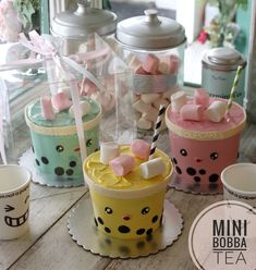 mini boba teas with marshmallows in them on a wooden table