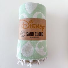 a towel with the disney sand cloud logo on it