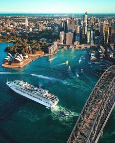 an aerial view of sydney, australia with the opera and harbour bridge in the foreground