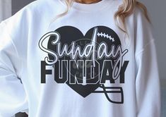 a woman wearing a sweatshirt with the words sunday fund day printed on it and a football helmet