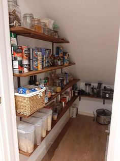 an open pantry with lots of food and containers on the shelve shelfs