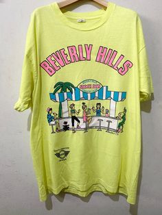 "Vintage 90s Beverly Hills Shirt Size: XL Made In USA Measurements are taken with the garment laying flat. Chest width: 23\" Body Length : 29.5\" Condition: Pre-owned 8/10 Material: 100% Cotton Comment Stain like pic No refund. -Payment : accept paypal only -Shipping : to shipping worldwide by registered airmail (small package) Thai post registered. receiving the item within 7-30 business days non sat-sunday working after payment cleared  (some case in Australia/italy/spain/north and south america 2-4 weeks) I ship every day, monday through Friday! Many times your item will go out same day!! Get your stuff super fast when you buy from me! -Check item status out of my country: http://track.thailandpost.co.th 11C" 90s Graphic Tees Vintage, 90s Beverly Hills, Vintage Beverly Hills, Genderqueer Fashion, Comfy Fall Sweaters, Official Dresses, La Dispute, Patagonia Shirts, Jeans Shirt