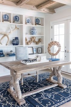 a dining room table with blue and white decor