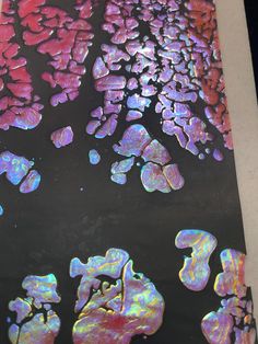 an abstract painting with pink, purple and blue colors on the bottom half of it