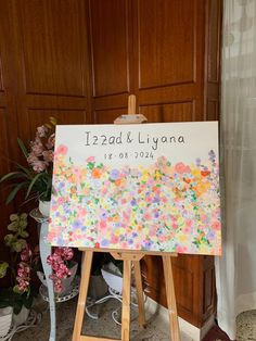 an easel with a wedding sign on it