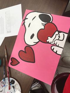 a painting of a dog holding a heart