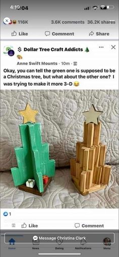 two wooden christmas trees sitting next to each other