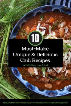 a blue bowl filled with chili and beans next to some green onions, carrots and celery