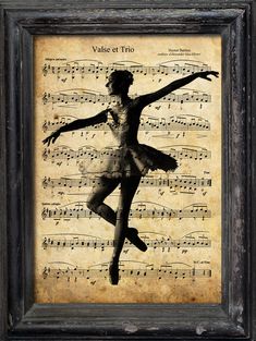 the silhouette of a ballerina in front of sheet music