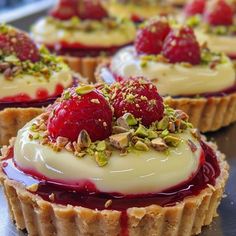 small desserts with raspberries and pistachio on top