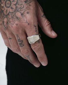 Latched onto the finger of a lucid luminary. Journeys etched with saged age, this ring is wrought with revelations of hidden dimensions, of destined designs. A 925 Sterling Silver signet ring surfaced with a time-worn texture. Bears an octagonal face. Demi-fine and forged for all genders and expressions. Sold individually. Each piece is lovingly crafted by hand, under ethical working conditions. Please allow for minor imperfections that are true to handcrafted jewelry. No two pieces are the same Modern Metal Signet Ring, Polished Metal Signet Ring, Luxury Brass Signet Ring, Luxury Silver Brass Signet Ring, Luxury Oxidized Finish Men's Signet Ring, Mens Ring Designs, Thick Ring, Silver Signet Ring, Gold Signet Ring