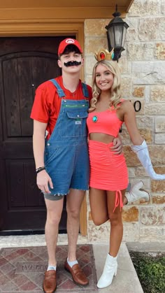 a man and woman dressed up in costumes