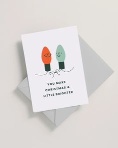 a card that says you make christmas a little brighter on the front and back of it