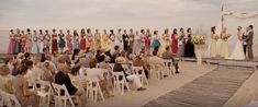 a group of people that are standing in front of each other at a wedding ceremony