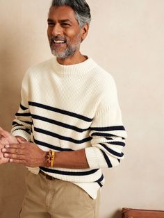 A modern take on the traditional fisherman's sweater, this mock-neck design is truly inspired with classic Breton stripes and luxurious ribbed texture.  Ours is crafted from 100% organic cotton and cut with side slits and a dropped shoulder for comfo Breton Stripes Outfit, Europe Clothes, Breton Stripes, Striped Knitted Sweater, Tie Sweater, Stripe Outfits, Fisherman Sweater, Fashion Project, Ribbed Texture