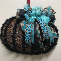 a leopard print hat hanging on the wall