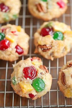 cookies with fruit and nuts are cooling on a rack