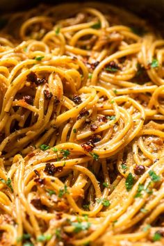 pasta with sauce and parsley in a pan