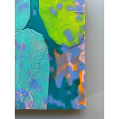 an abstract painting with blue, green and yellow colors