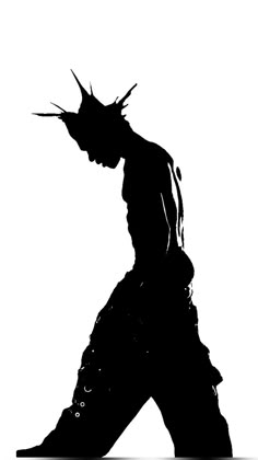 the silhouette of a man with spikes on his head is shown in black and white