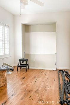 an empty room with hard wood flooring and white paint on the walls is being remodeled