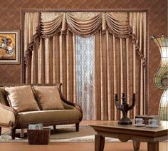 a living room filled with furniture and brown curtains on the window sill, along with a coffee table