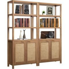 an entertainment center with bookshelves and speakers