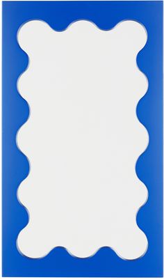 a blue and white frame with scalloped edges on a plain background that looks like it has been cut in half